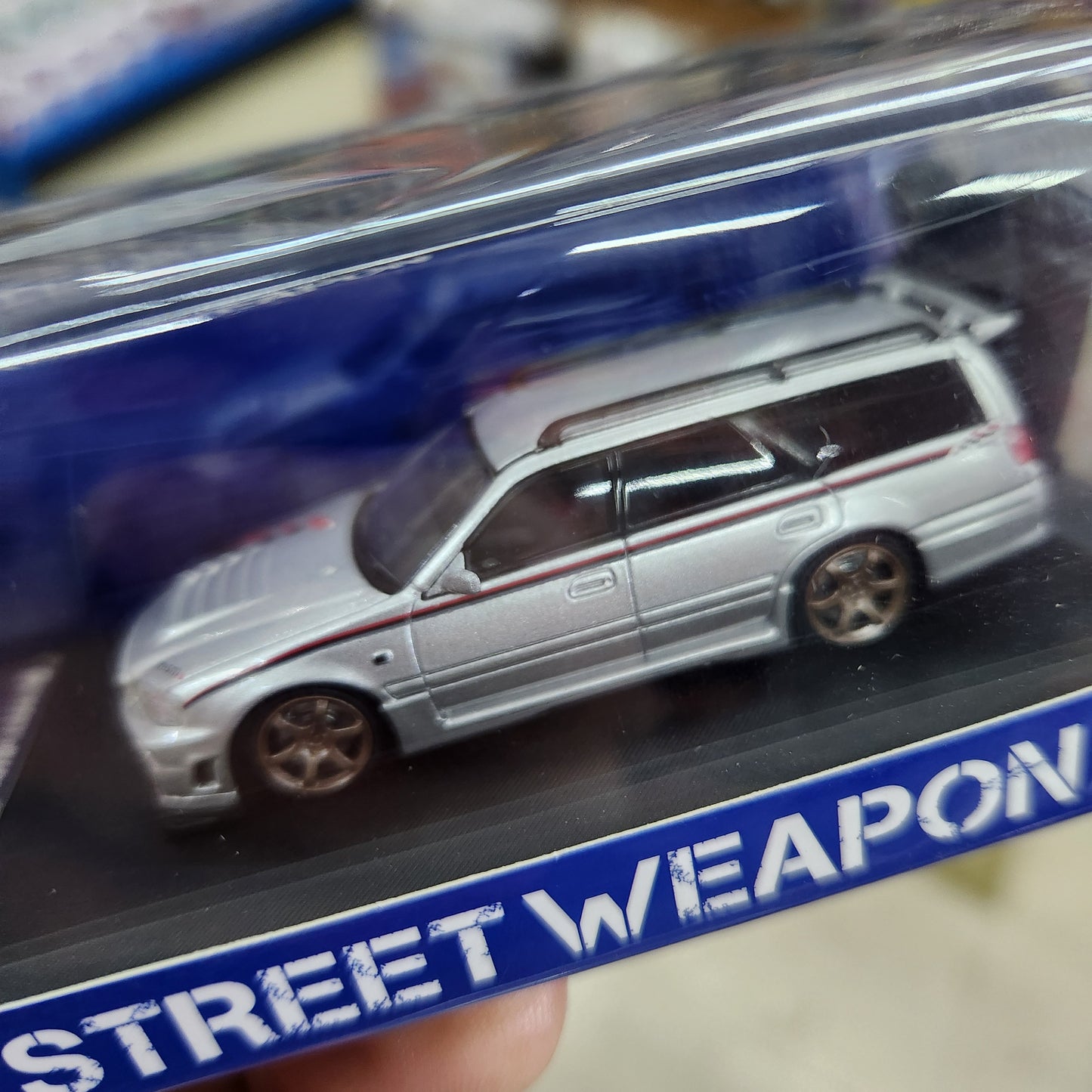 Street Weapon - Nissan Stagea (R34) Silver - 1:64 Scale