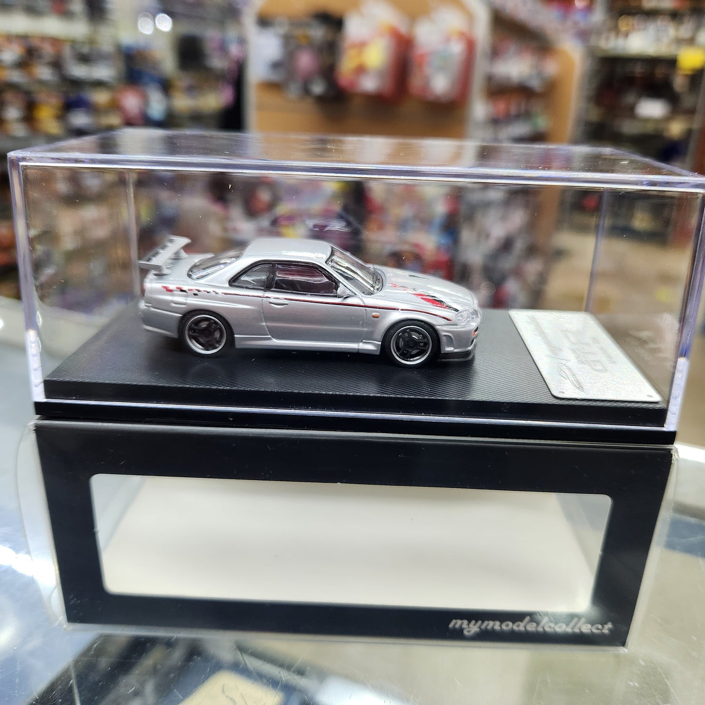 MyModelCollect - Nissan Skyline GT-R (R34) V-Spec (Silver) - 1:64 Scale