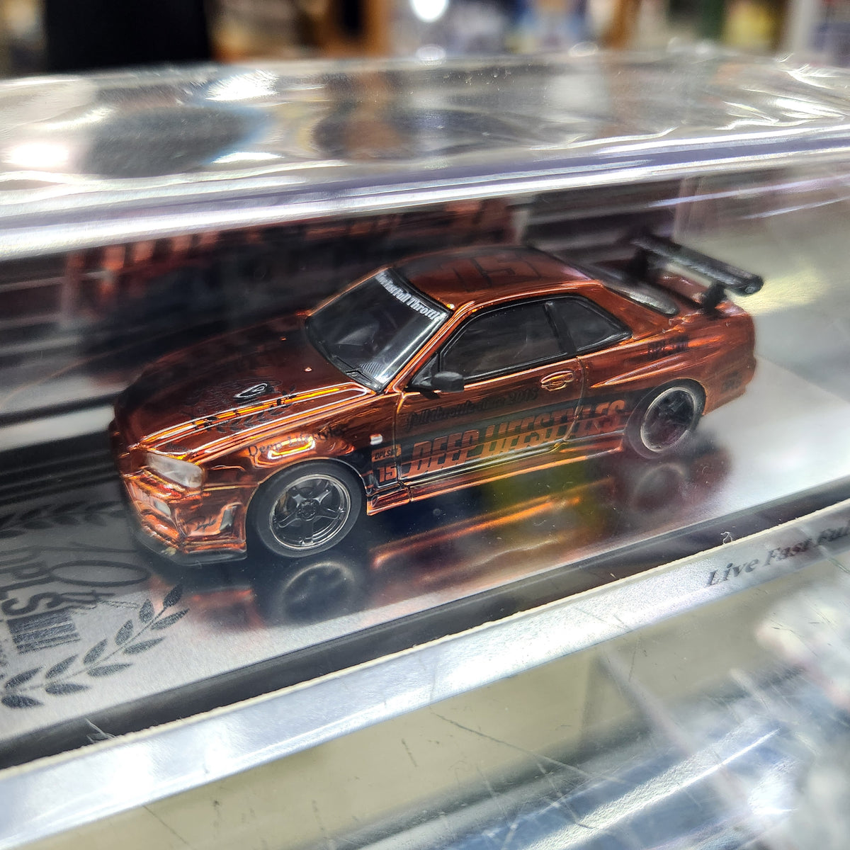 INNO64 - Nissan Skyline (R34) DPLS '10th Anniversary' (Chrome Orange)