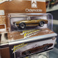 Johnny Lightning - 2023 Collector Tin R1 Vers. A - 1970 Olds 442 Convertible - Burnished Gold