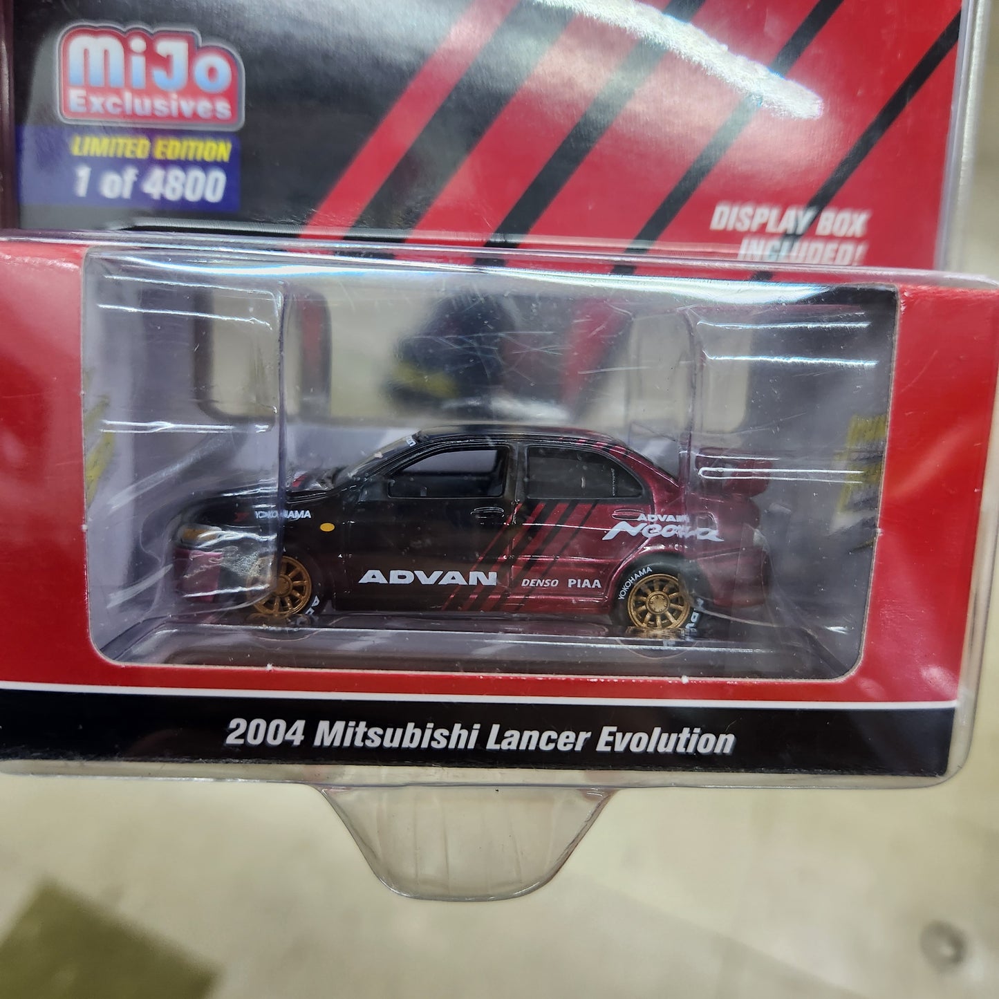 Johnny Lightning - Mitsubishi 2004 Lancer Evolution 'ADVAN Yokohama' - 1:64 Scale