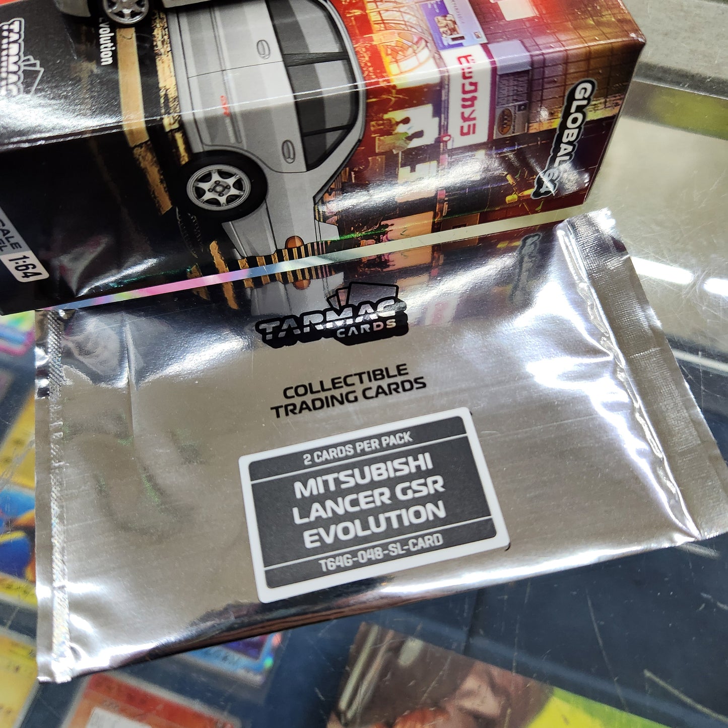 Tarmac Works - Mitsubishi Lancer GSR Evolution Silver (With Cards) - 1:64 Scale