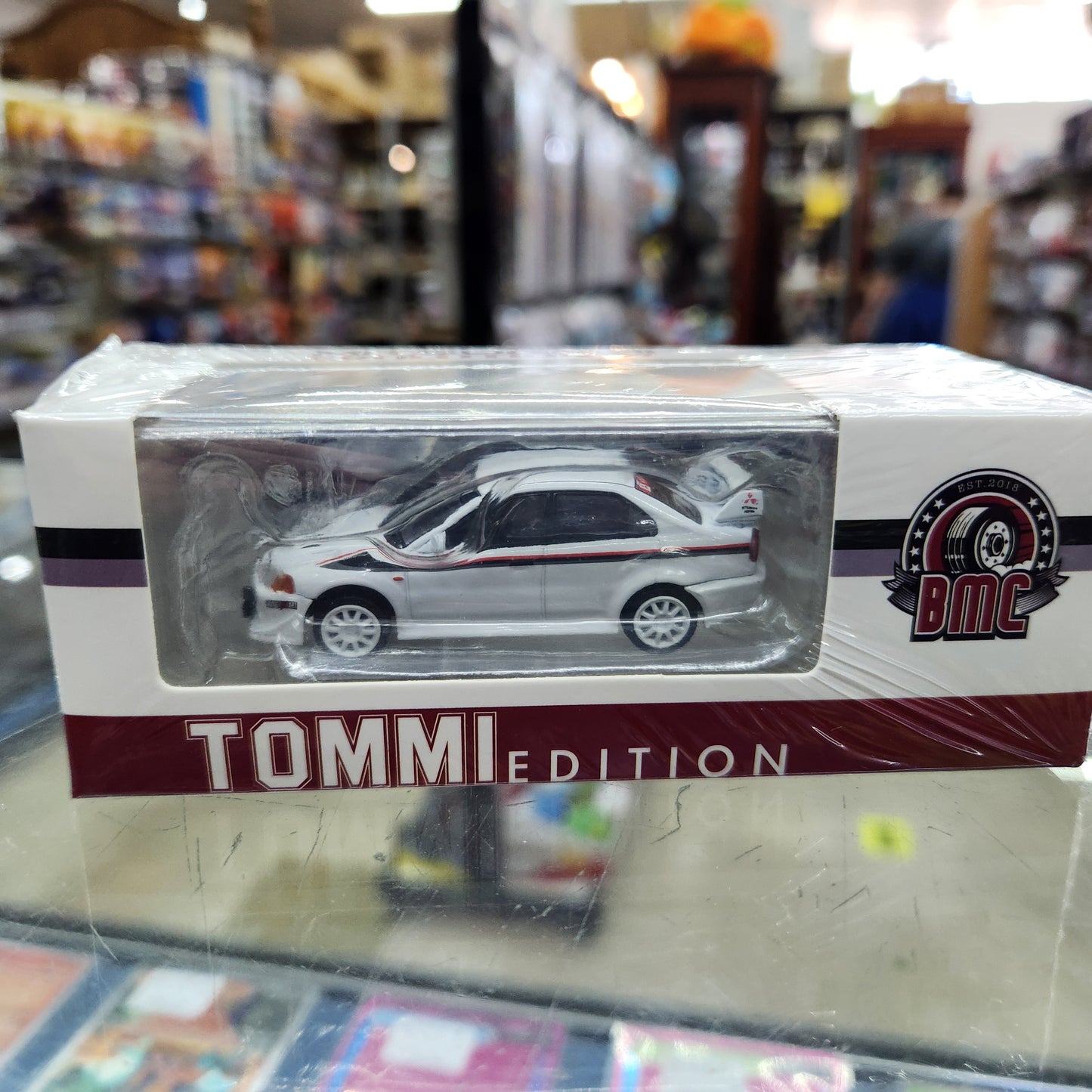 BMC - Mitsubishi Lancer Evolution VI 'Tommi Edition' (White) - 1:64 Scale