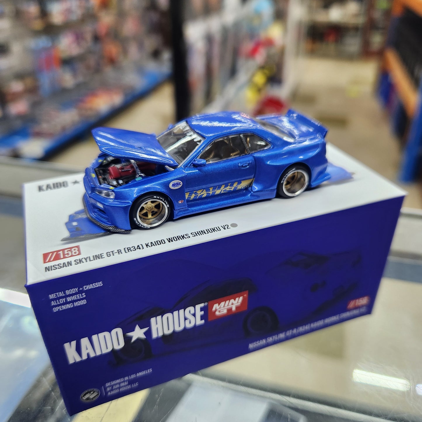 MiniGT - Nissan Skyline GT-R (R34) Kaido Works 'Shinjuku' V2