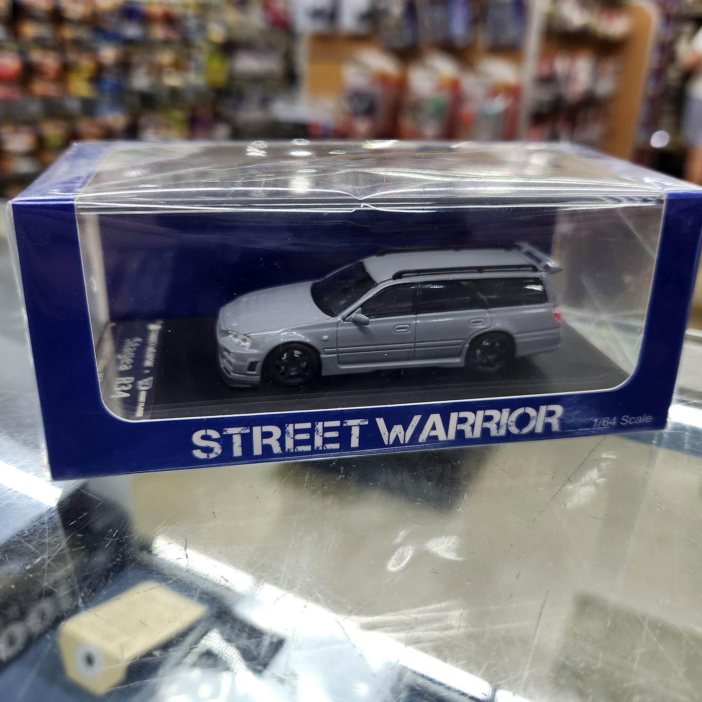 Street Weapon - Nissan Stagea (R34) Naduo Grey - 1:64 Scale