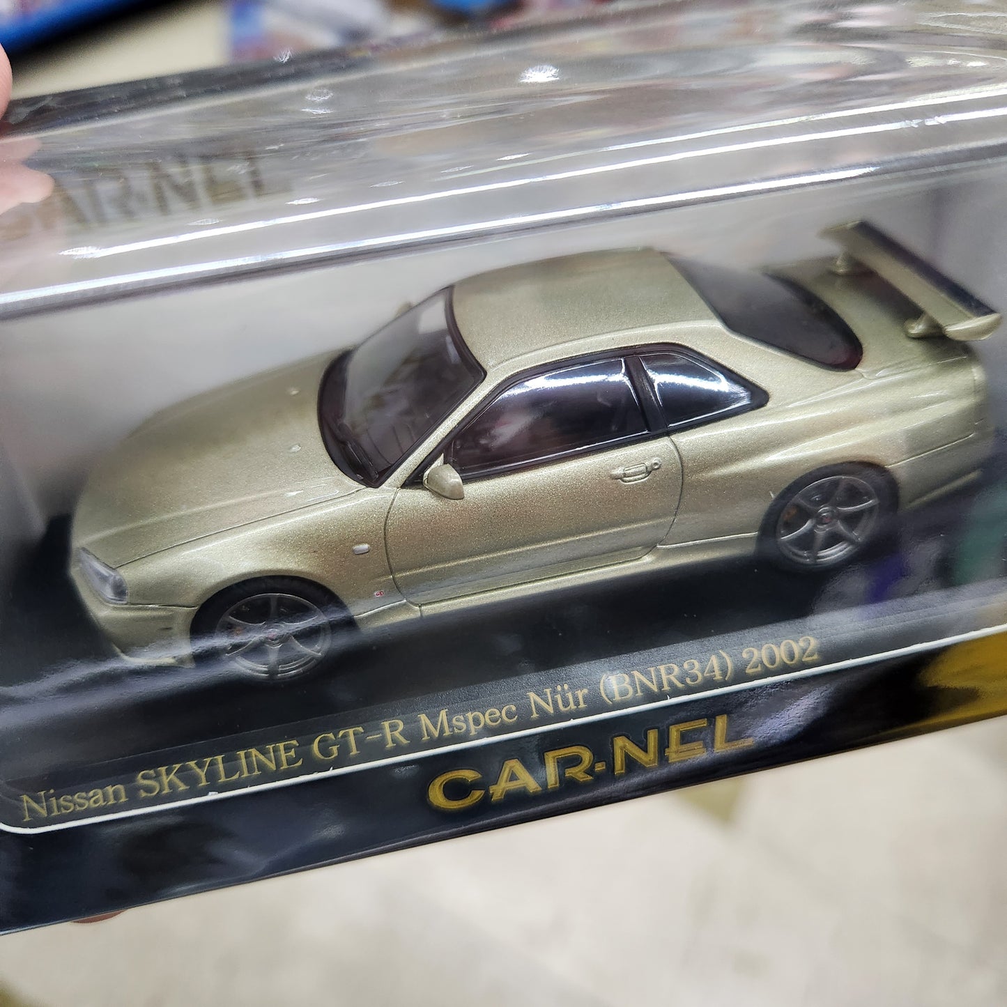 Carnel - Nissan Skyline GT-R (R34) MSpec Nur 2002 (Silica Brass)- 1:43 Scale