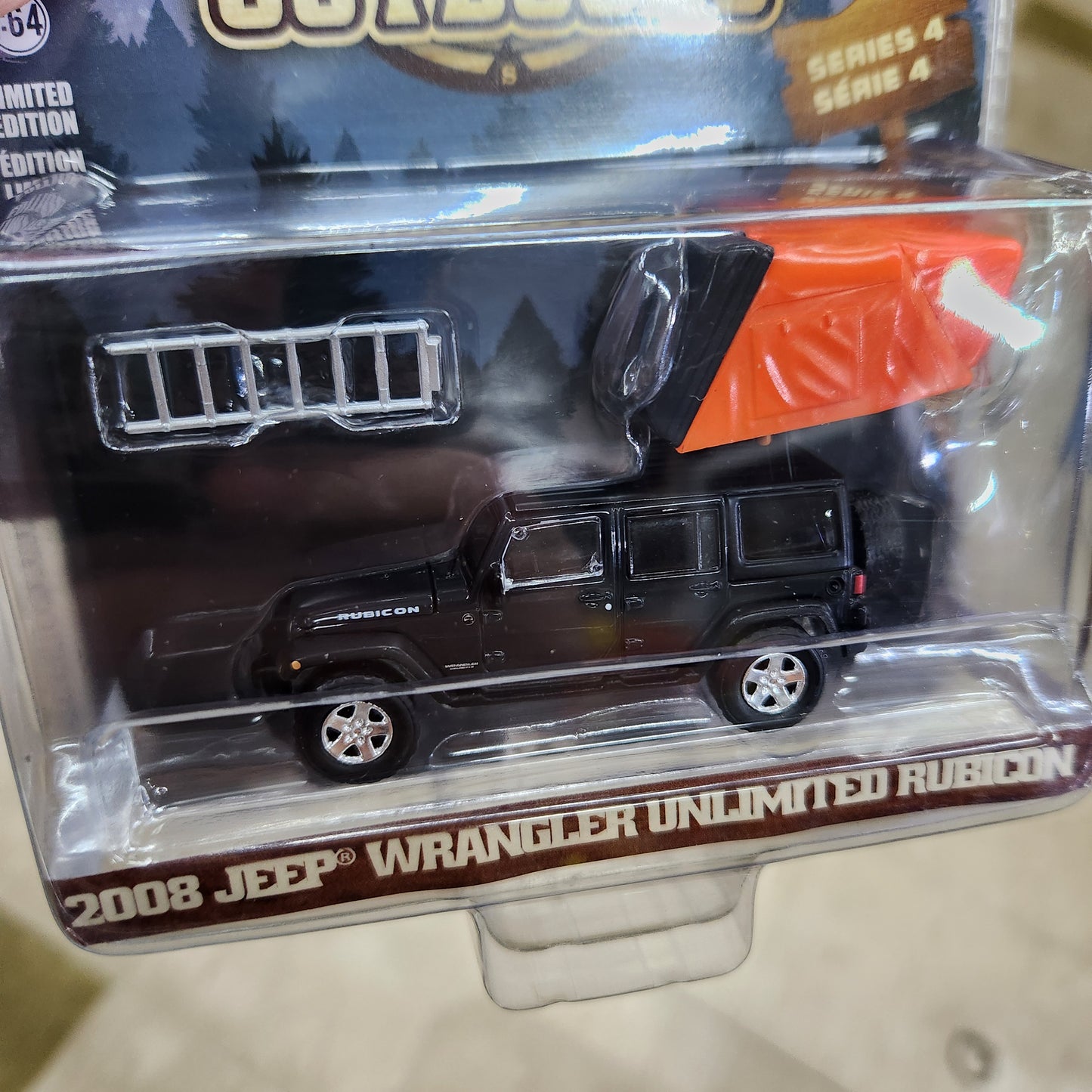 Greenlight - The Great Outdoors Series 4 - 2008 Jeep Wrangler Unlimited Rubicon (Dark Charcoal) with Camper