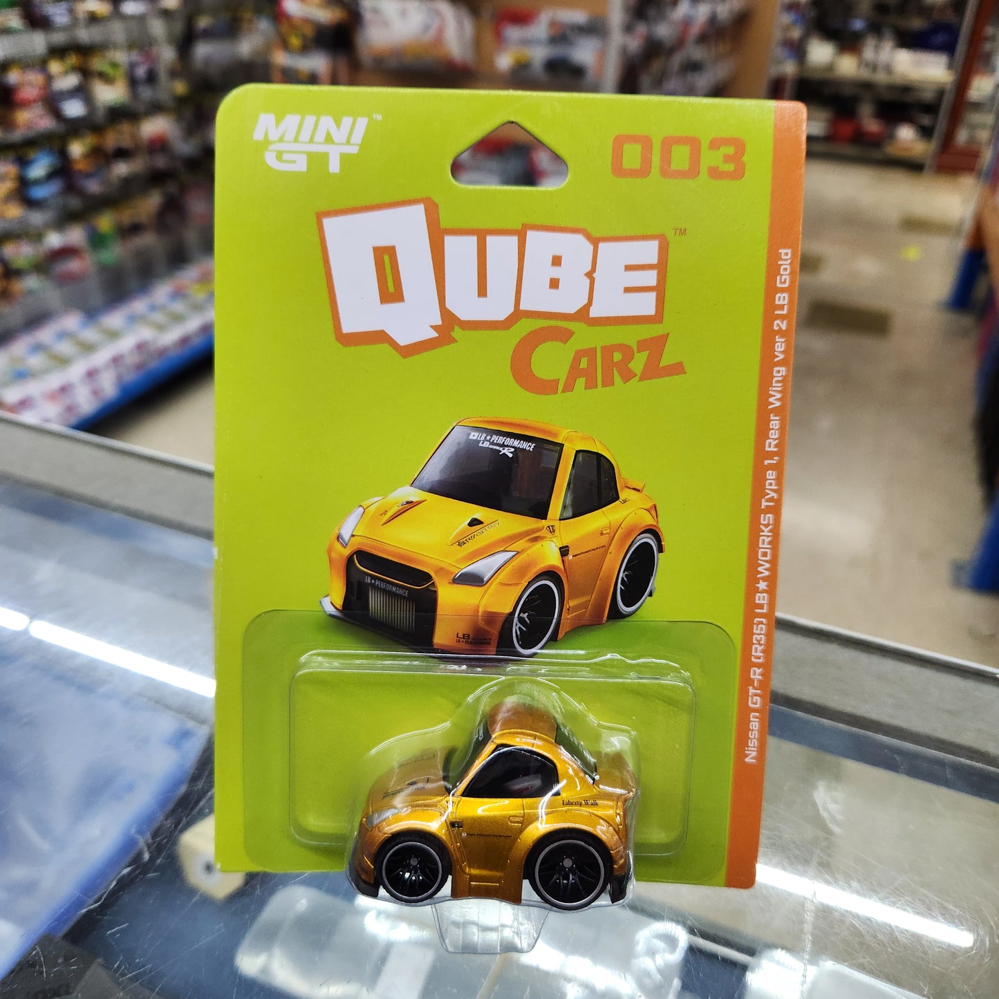 MiniGT - Qube Carz - Nissan GT-R R35 LB Liberty WORKS Type 1, Rear Wing Ver 2 LB Gold