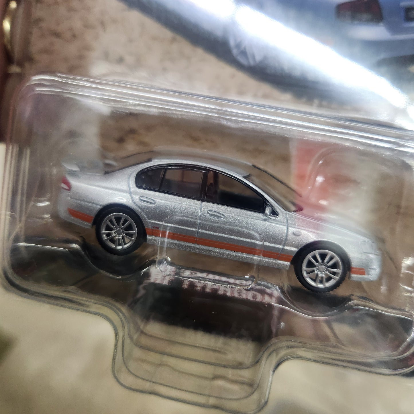 Oz Wheels - Fully Sick Detail - Series 3 - Ford FPV BF Falcon Typhoon (Silver/Orange) - 1:64 Scale