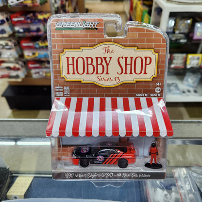 Greenlight - The Hobby Shop Series 13 - 1999 Nissan Skyline (R34) with Race Car Driver